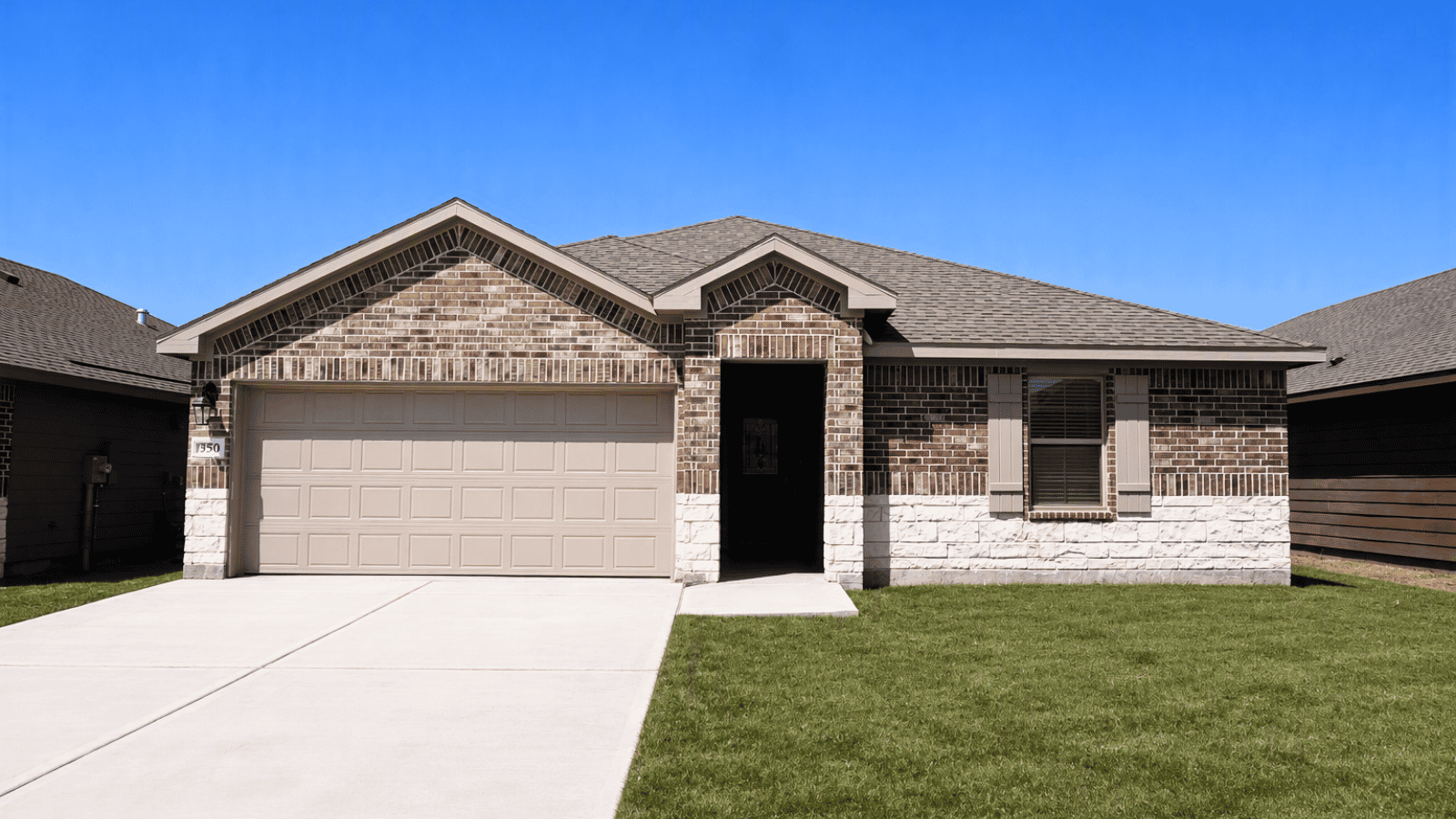 single family one story home with two car garage