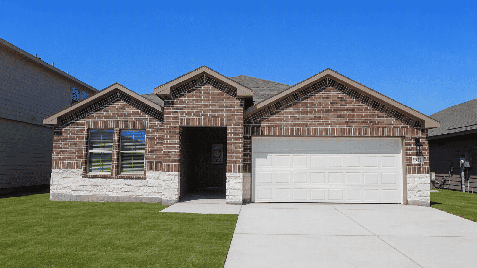 single family one story home with two car garage