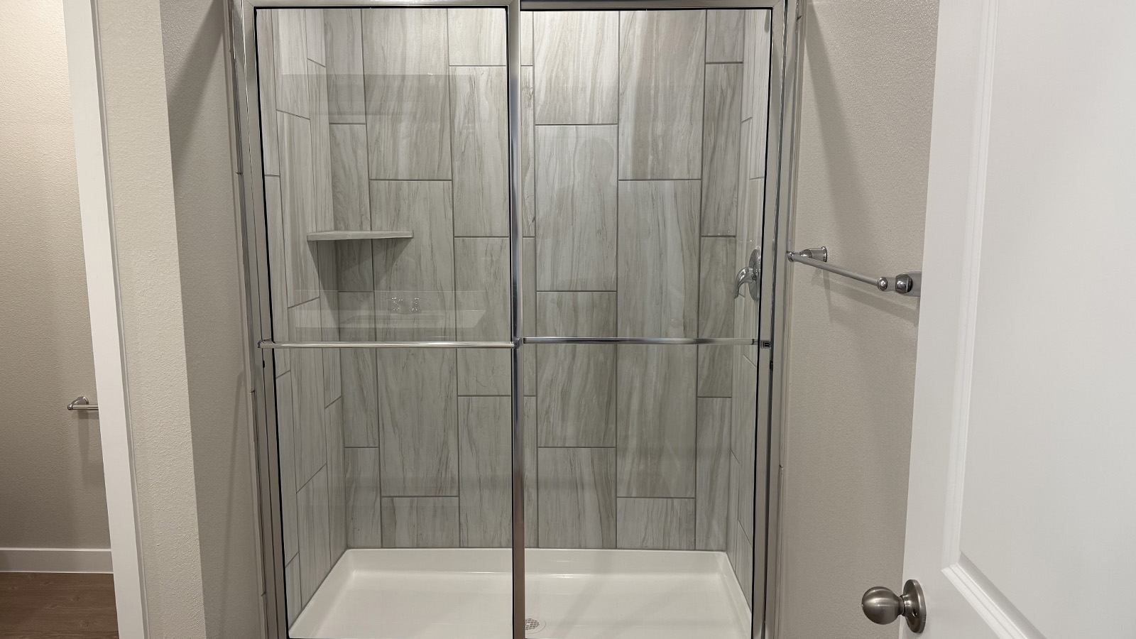 Owner’s ensuite in a new build home offers function and style with a walk-in closet, spa-like ensuite