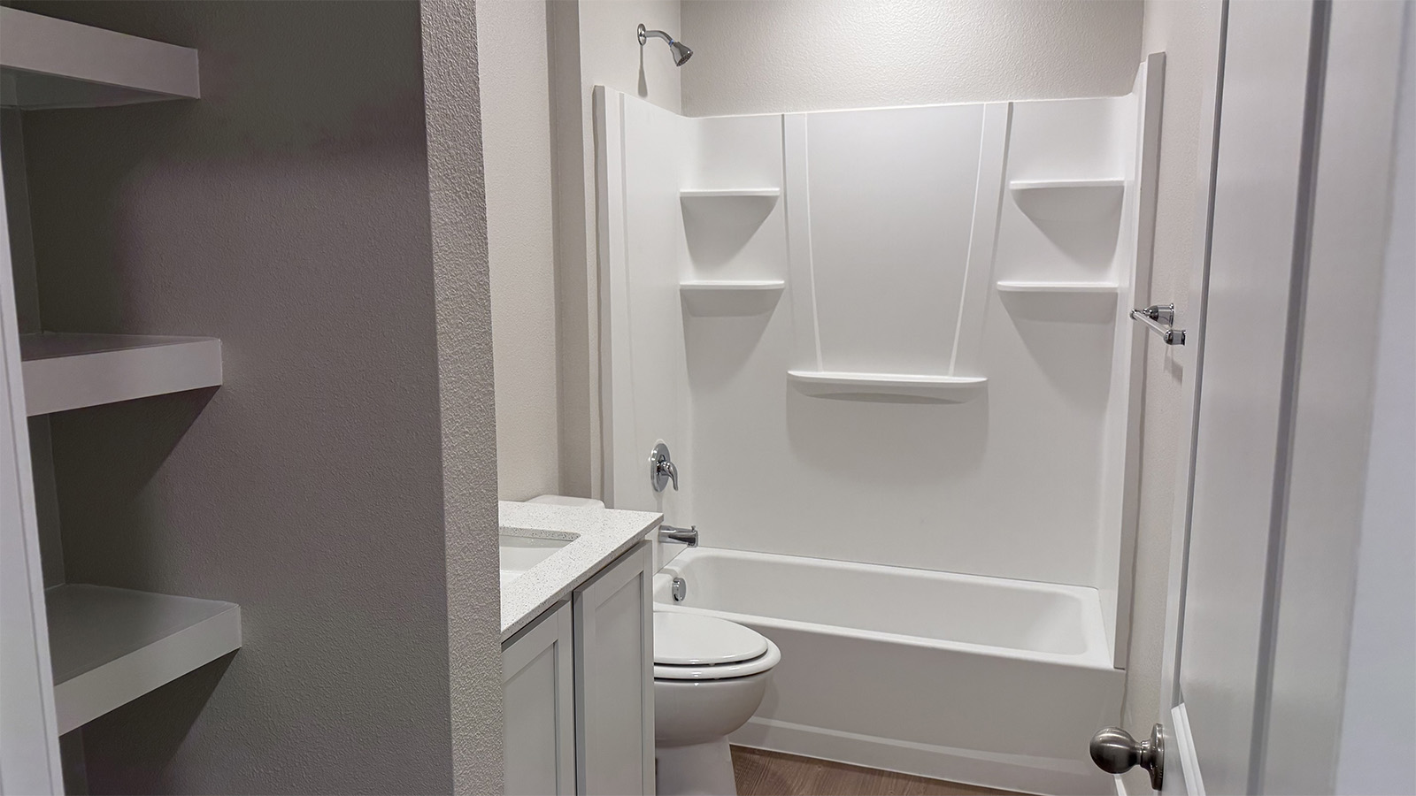 Family full bathroom with stylish vanity, mirror, polished fixtures, cabinets, tub-shower combo in Shiloh Springs