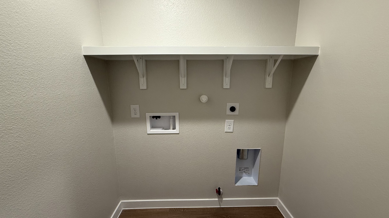 Shiloh Springs utility laundry smartly designed with overhead organized storage, a drop zone, with new washer, dryer included