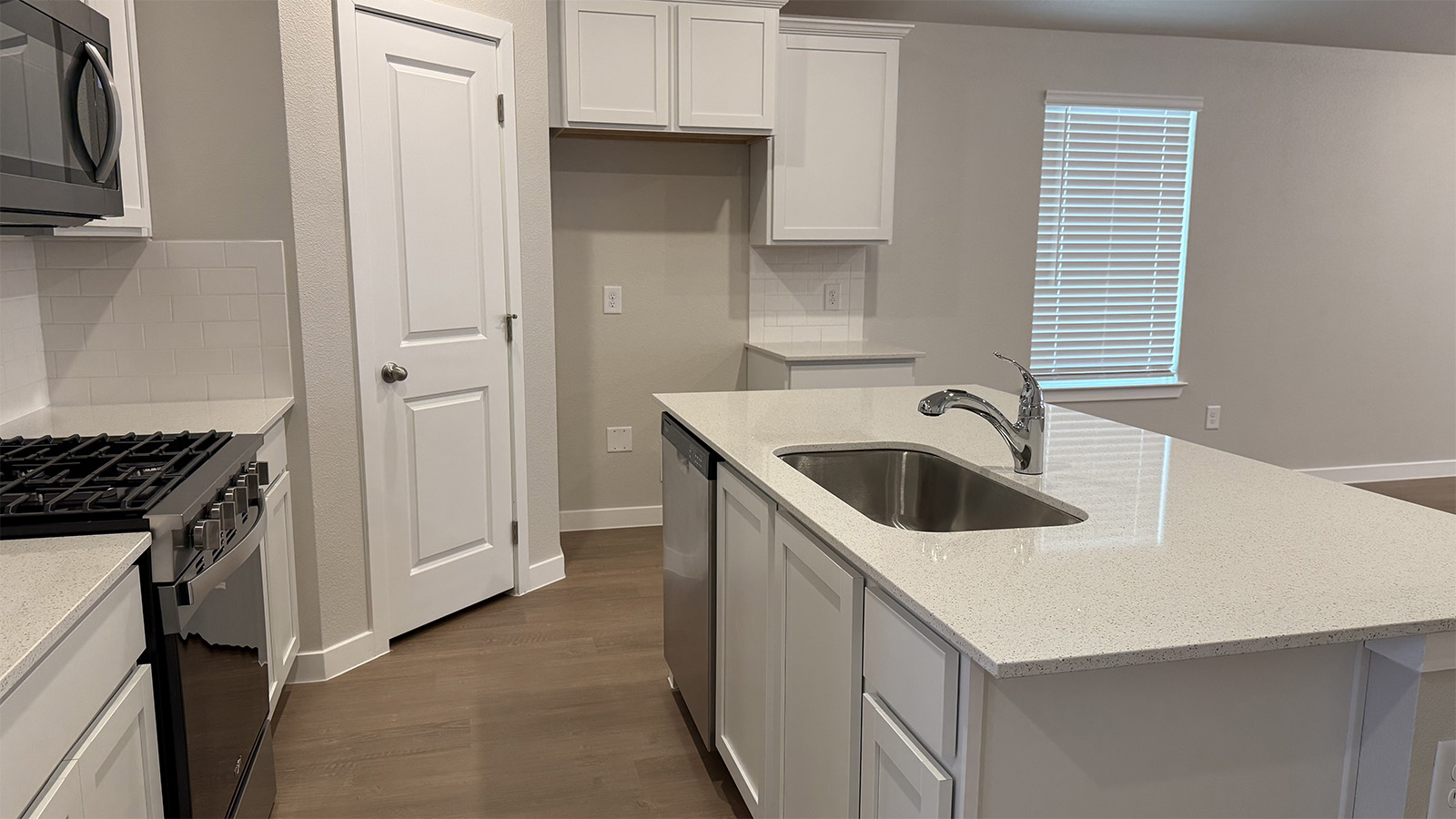 New appliance suite included, our larger kitchen island with seating anchor the kitchen, next to dining, great rooms, pantry