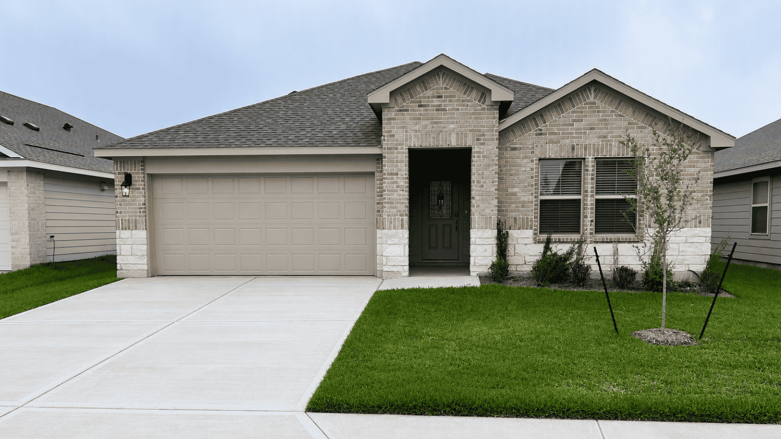 single family one story home with two car garage