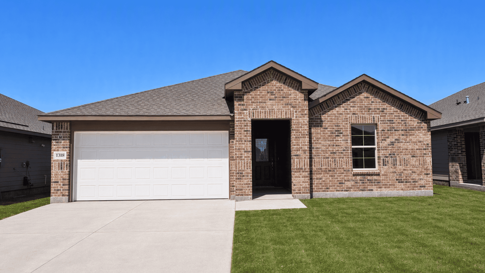 single family one story home with two car garahe