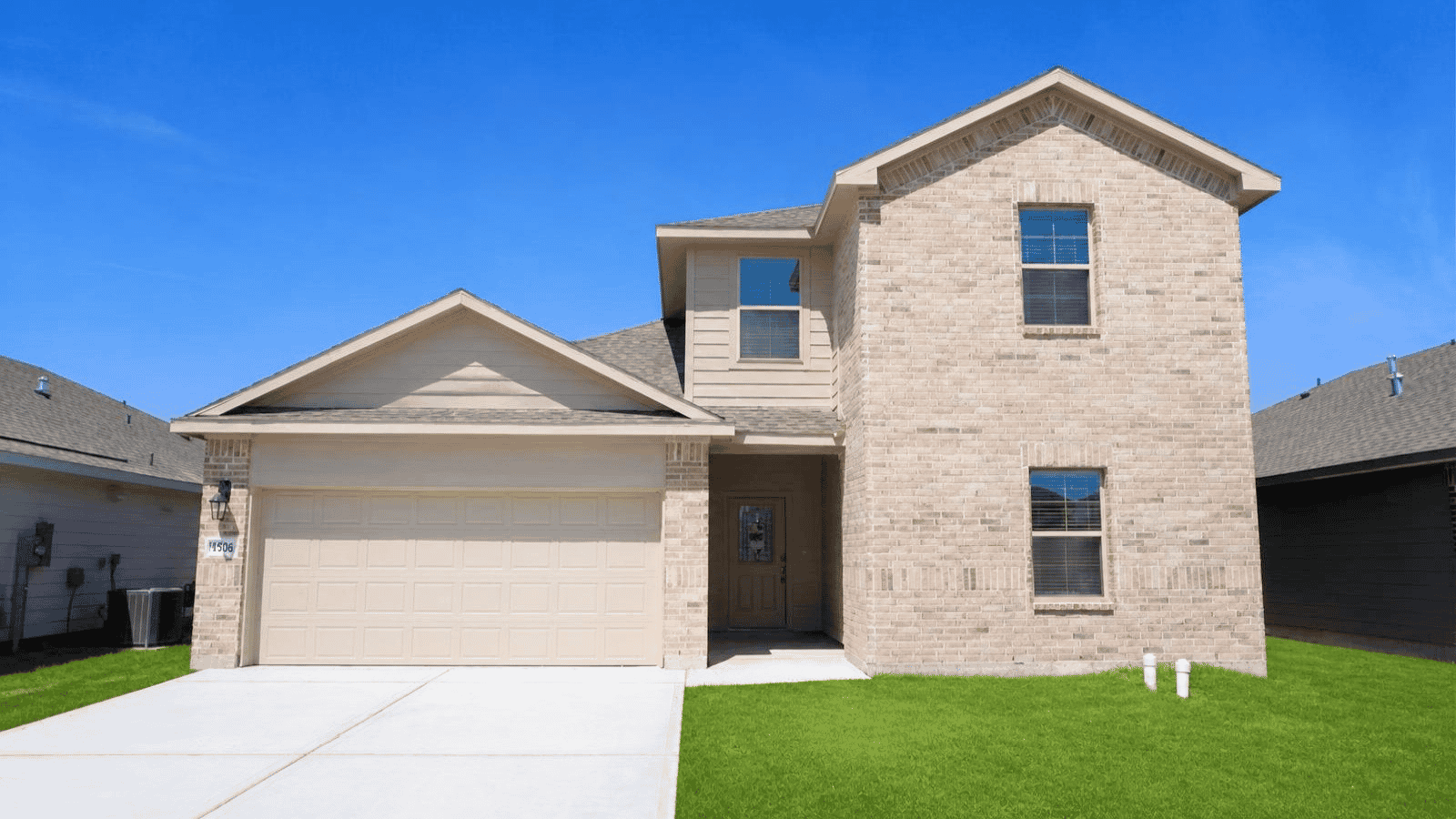single family two story home with two car garage