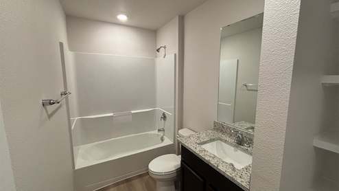 Second Bath with tub shower combo and granite counters