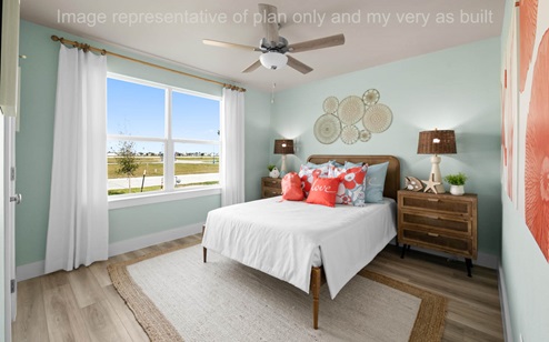 Bed two at front of home with queen bed and large window