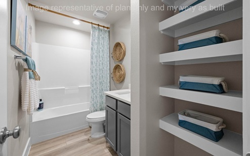 Bath 2 with tub shower combo and open shelving