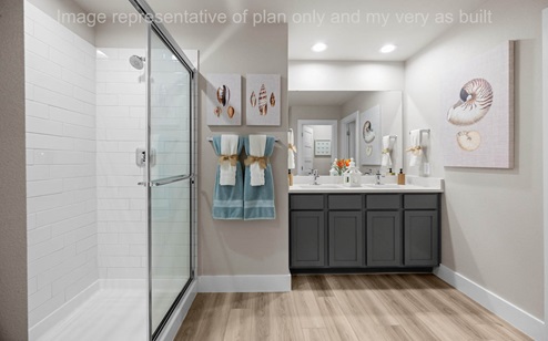 primary bath with quartz counters and double sinks