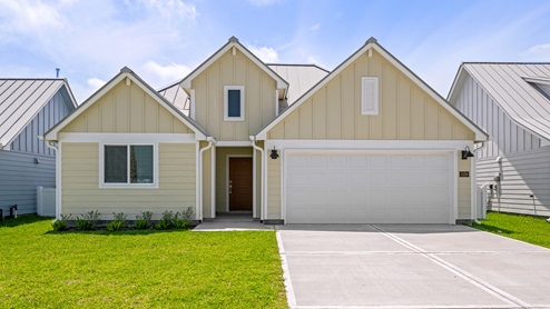 Front of Mustang plan in yellow coastal modern exterior