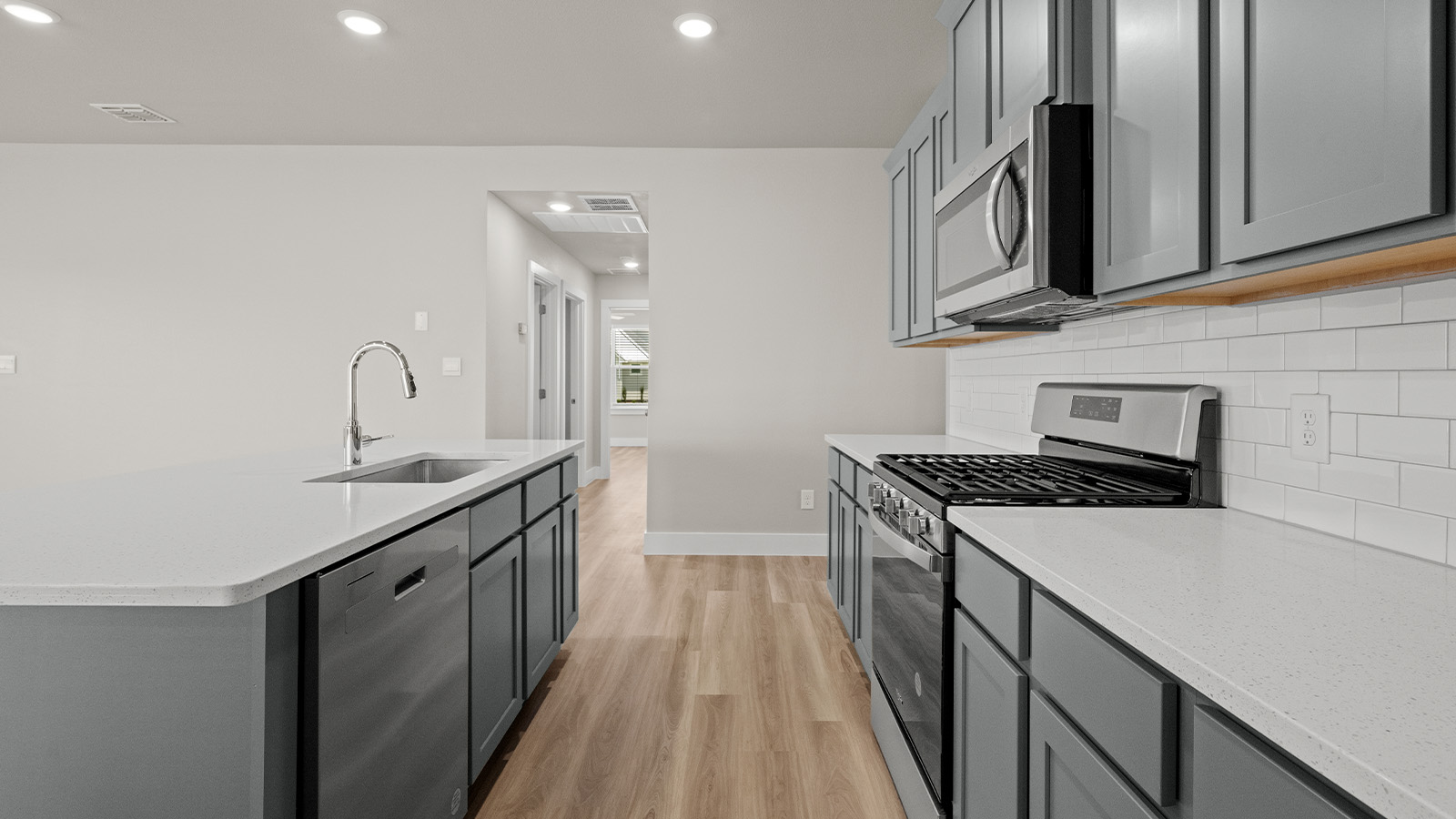 Kitchen with stainless steel appliances and gas stove