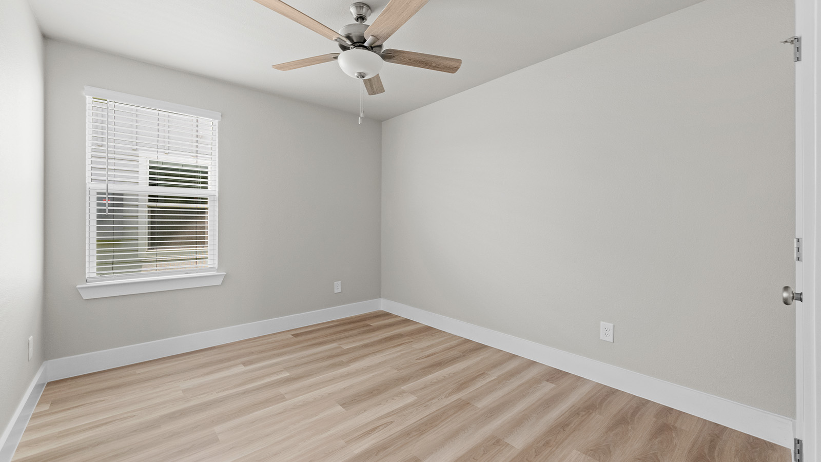 Bedroom 2 with large window EVP flooring and celling fan