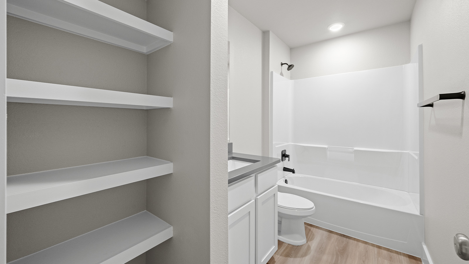 Second bathroom with open shelving