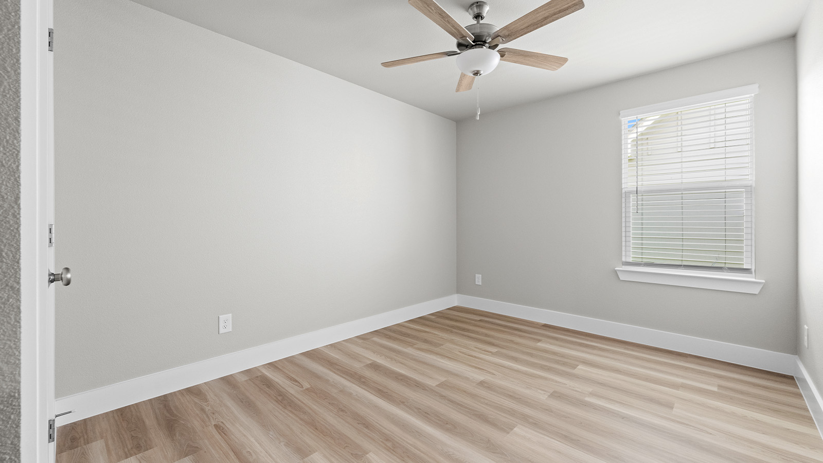 Bedroom 2 with large window EVP flooring and celling fan