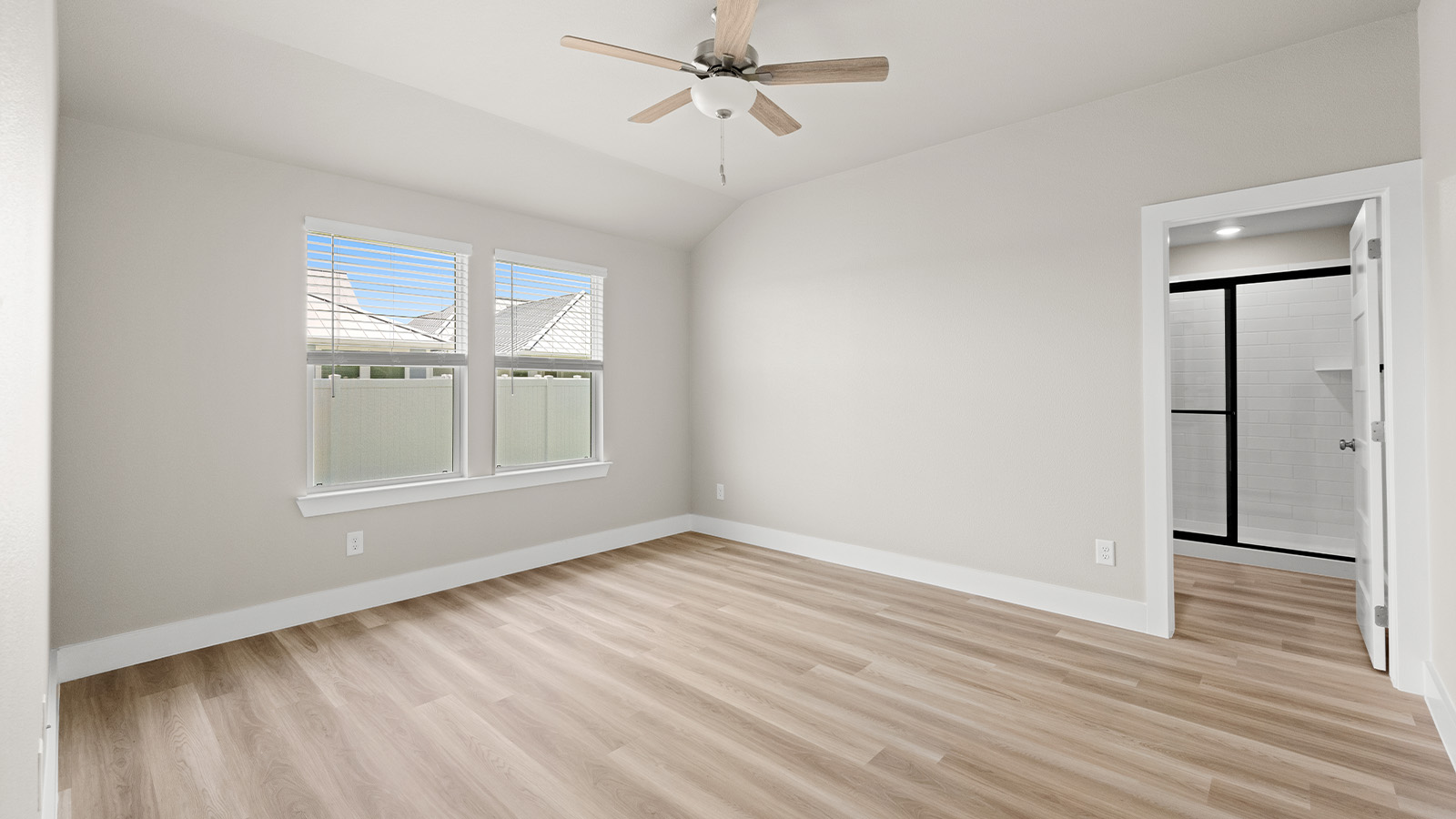 Primary bedroom with EVP flooring and connected bath