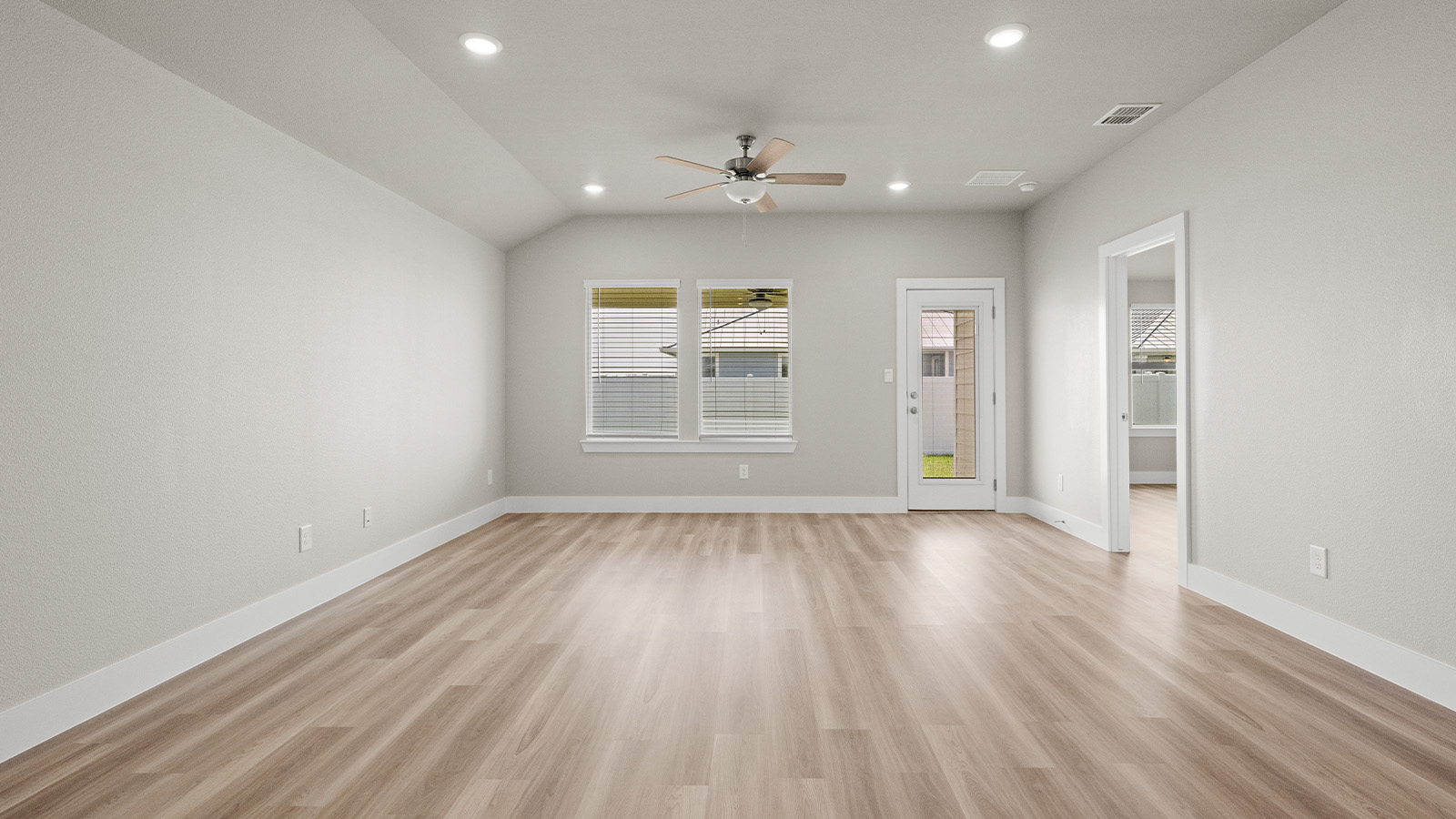 Living room with patio leading to back yard