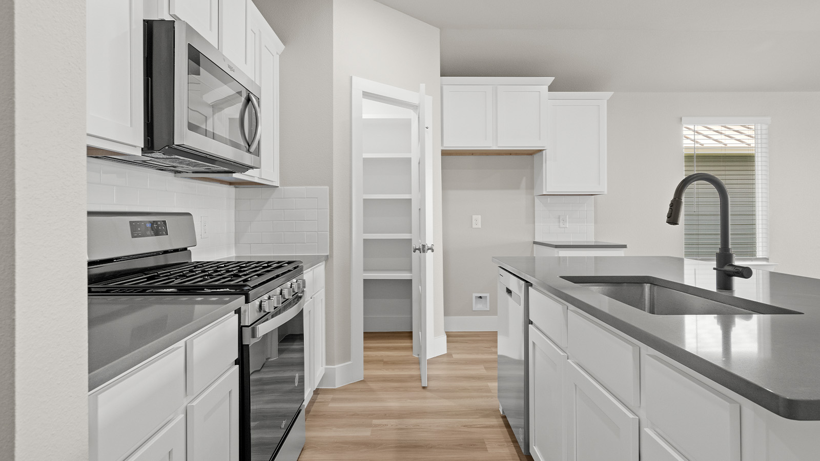 Kitchen with stainless steal appliances including gas stove