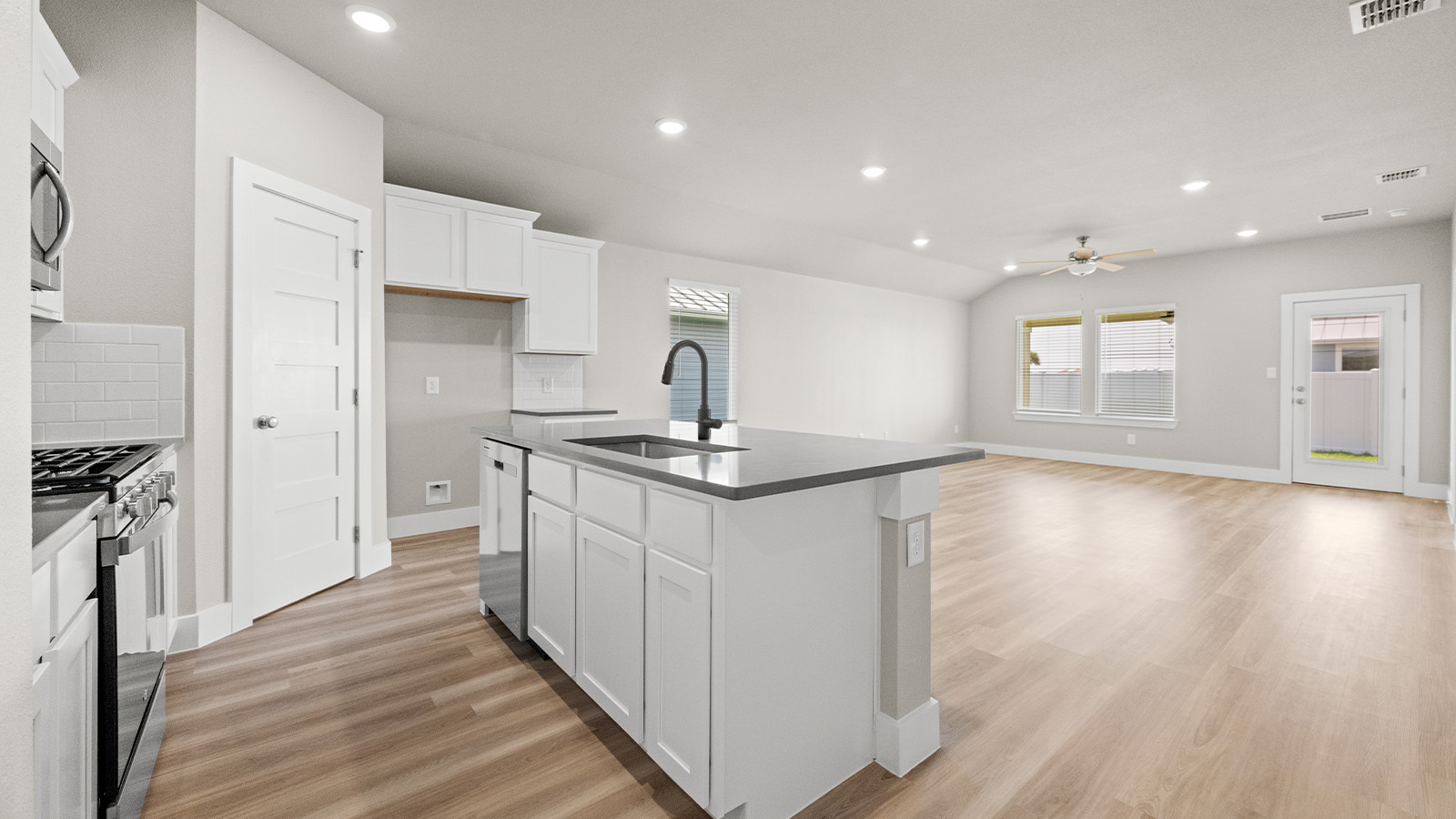 Open concept kitchen dining and living room