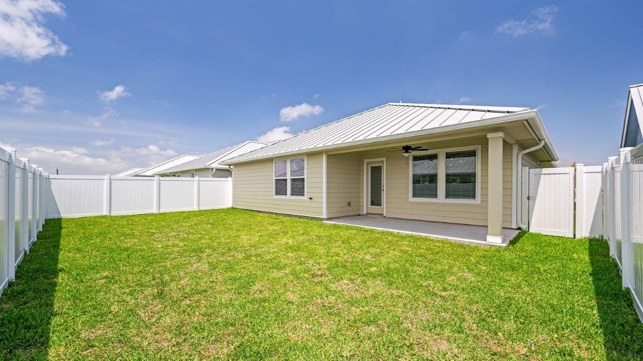 Back yard with full vinyl fencing