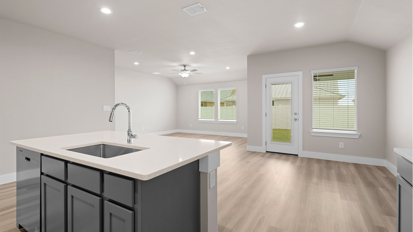 Open concept living kitchen and dining with luxury vinyl plank floor