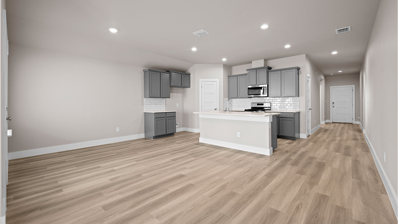 Open concept living kitchen and dining with island kitchen with breakfast bar