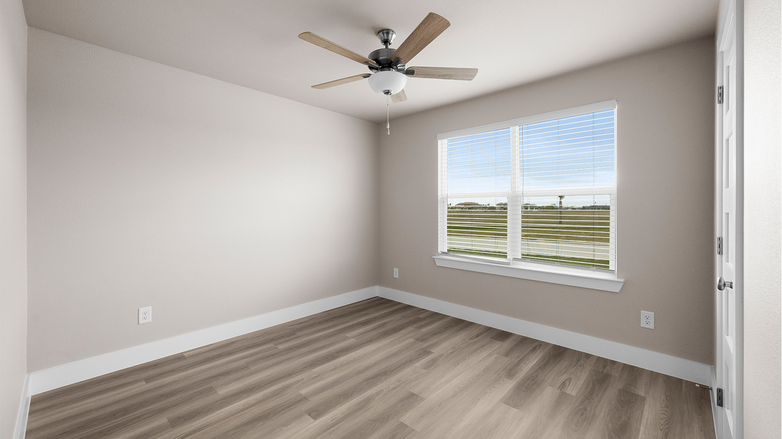Front bedroom with large window luxury vinyl plank flooring and ceiling fan