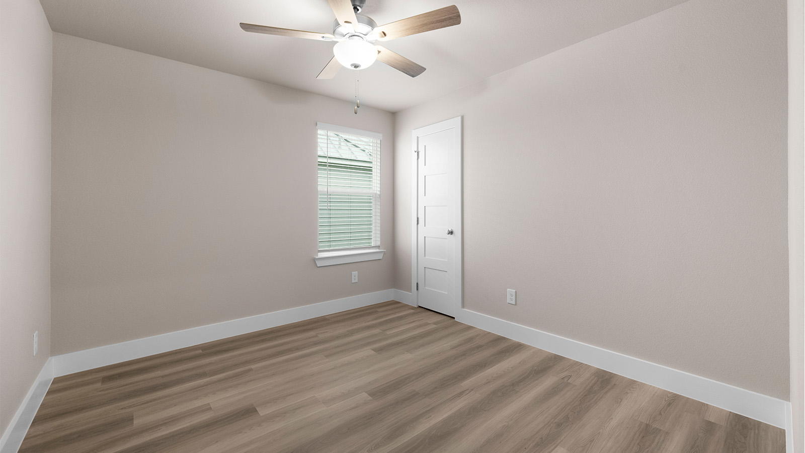 bedroom 3 with luxury vinyl plank flooring and ceiling fan upgrade