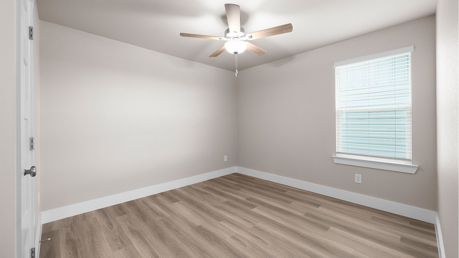 fourth bedroom with luxury vinyl plank floor and ceiling fan upgrade