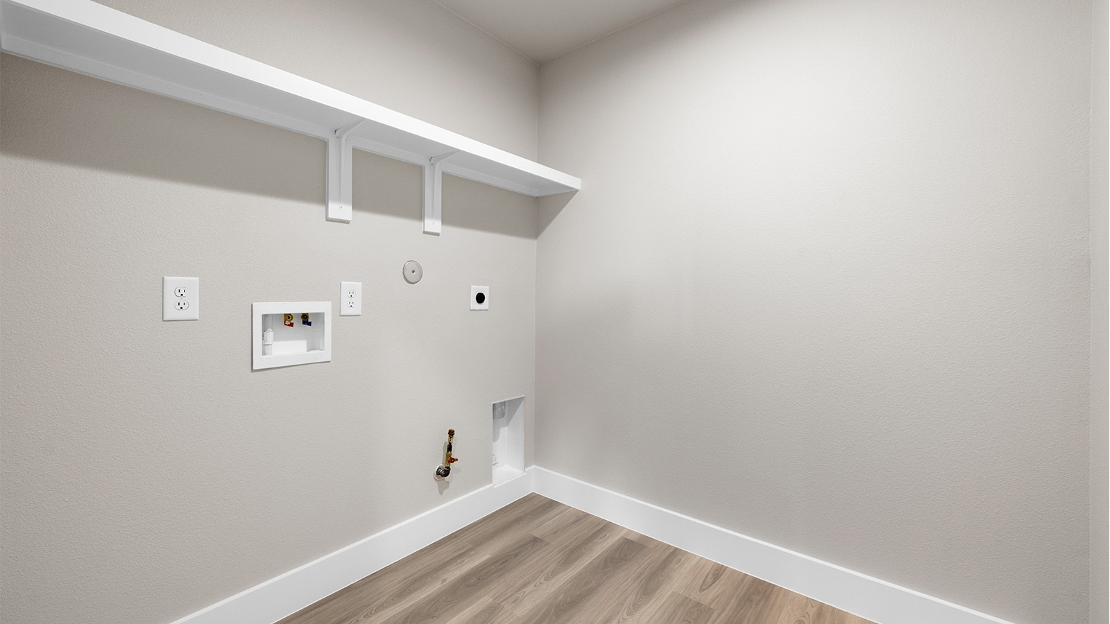 laundry room with gas and electric connections and storage shelf