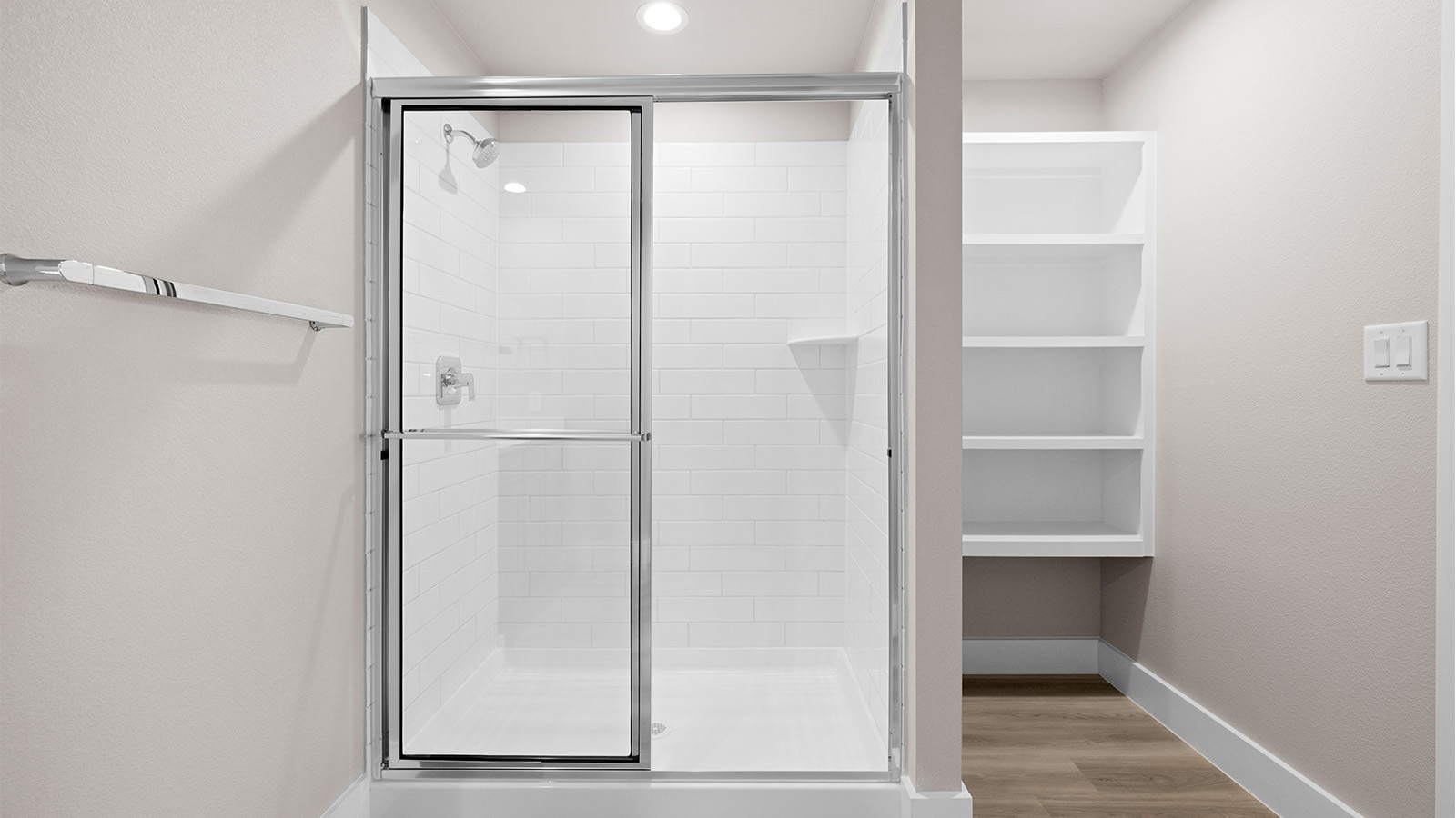 primary bath with walk in shower and modern open shelving