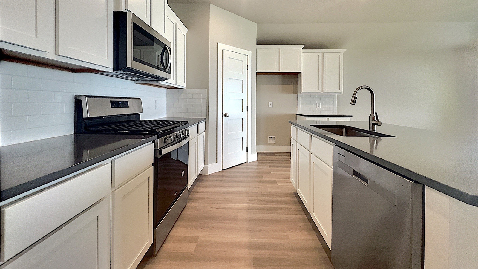 Kitchen with stainless steel appliances and gas range