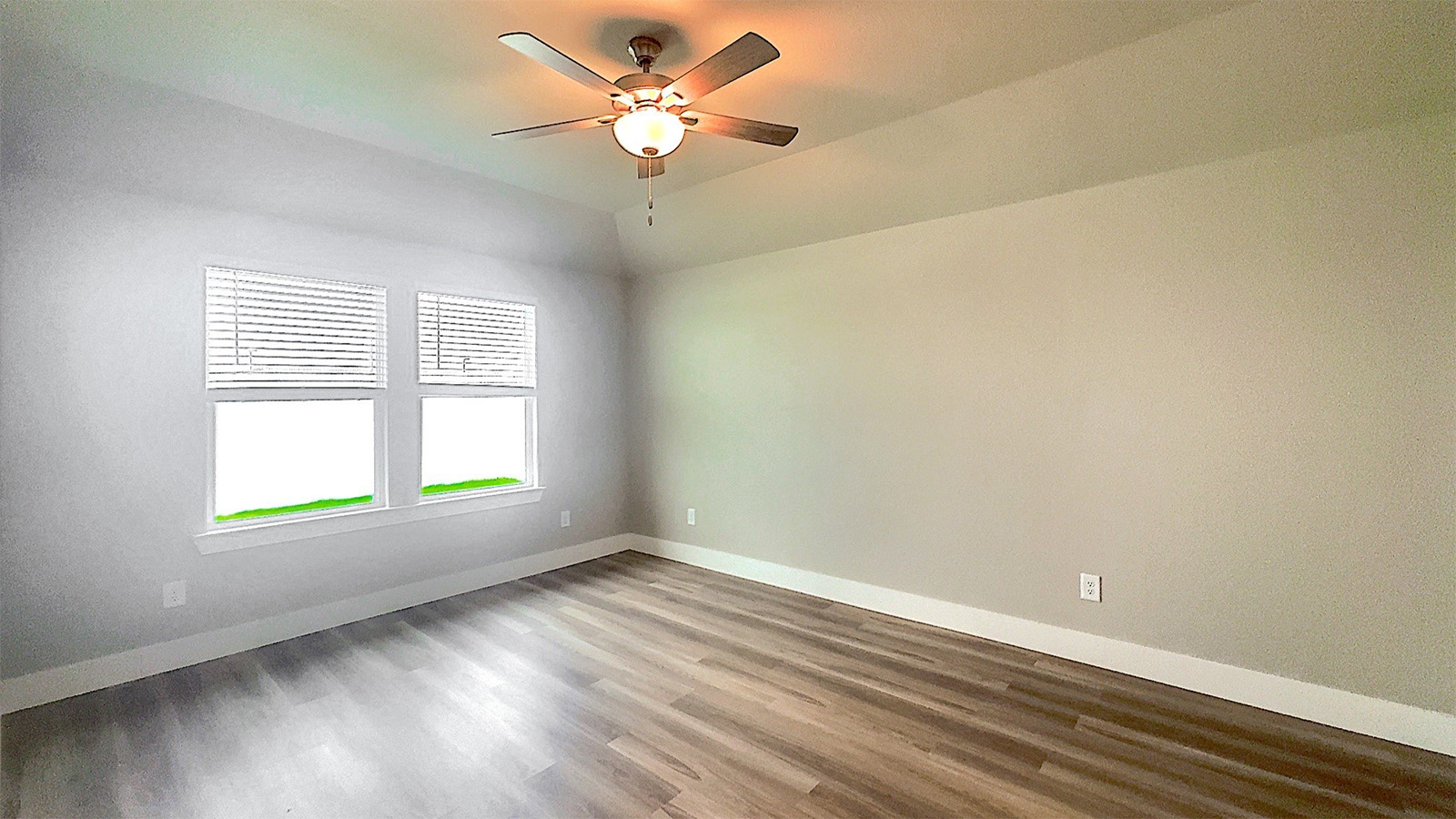 Primary Bedroom with large window overlooking backyard