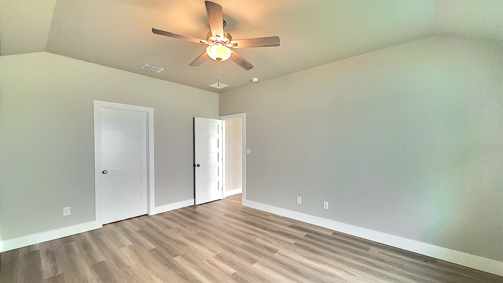 Primary bedroom with attached bathroom