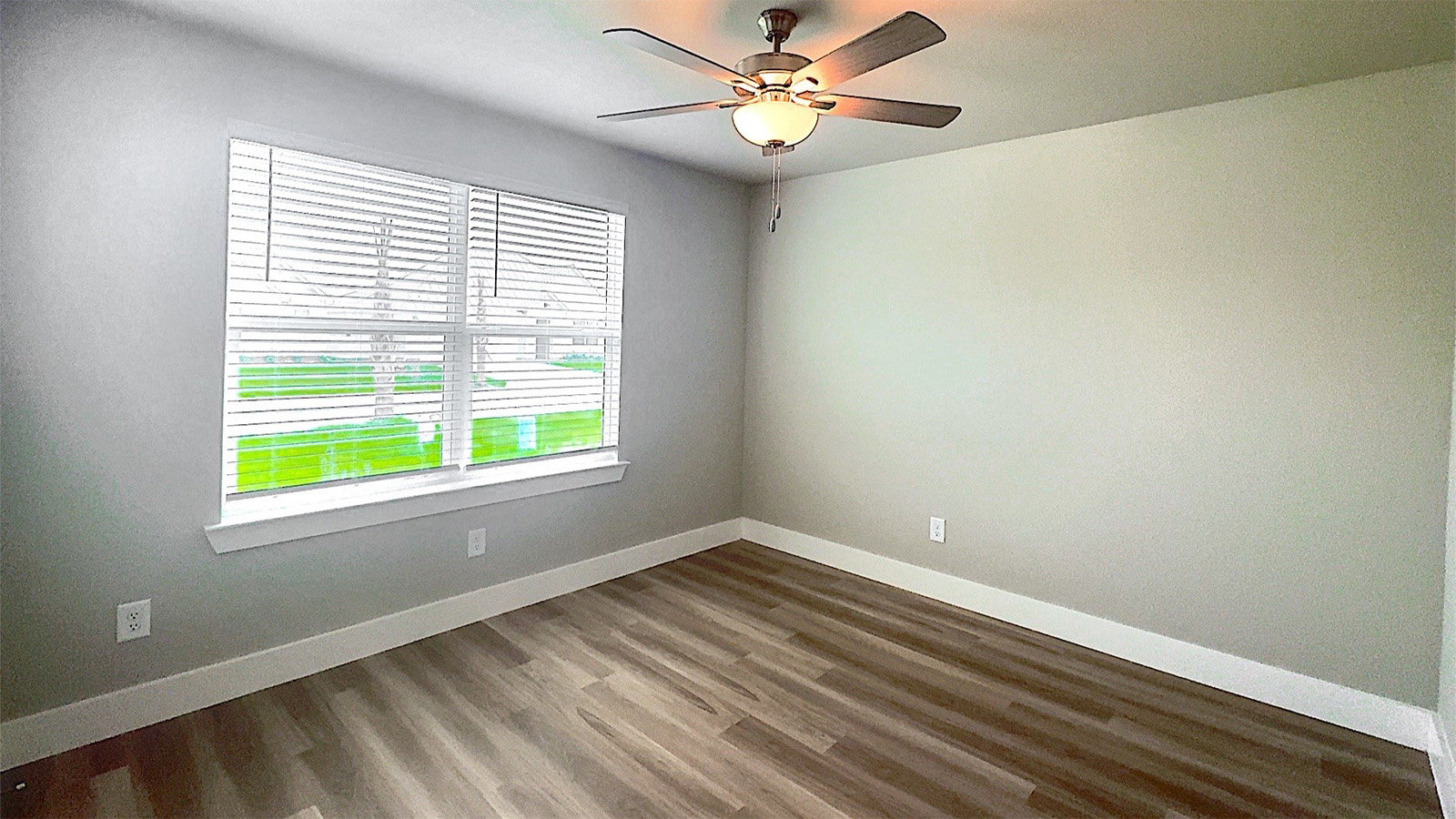 Bedroom 2 with large divided light window