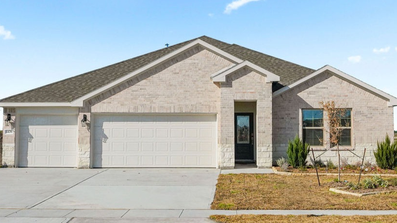 single family one story home with three car garage
