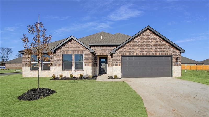 Irving floor plan is a one story home with two gables, a stone and brick exterior, four windows, a multipaned front door and a two car garage.