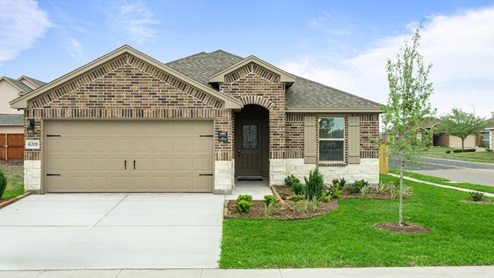 A single-story mixed brown brick house, with white stone detail, tan shutters and a two-car garage.