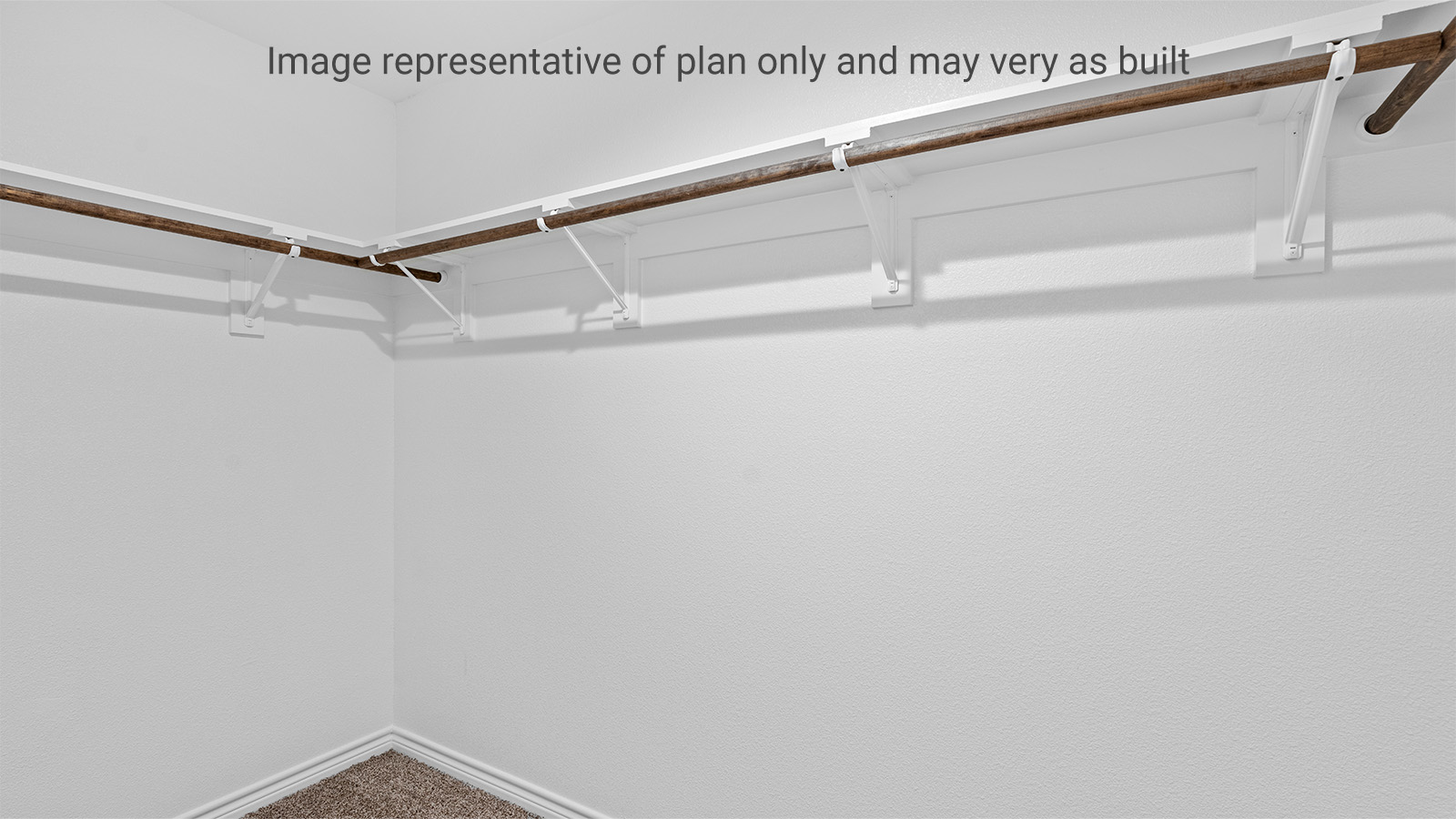 New home primary walk-in closet adds crafty organized space designed by D.R. Horton's Bridges Mill