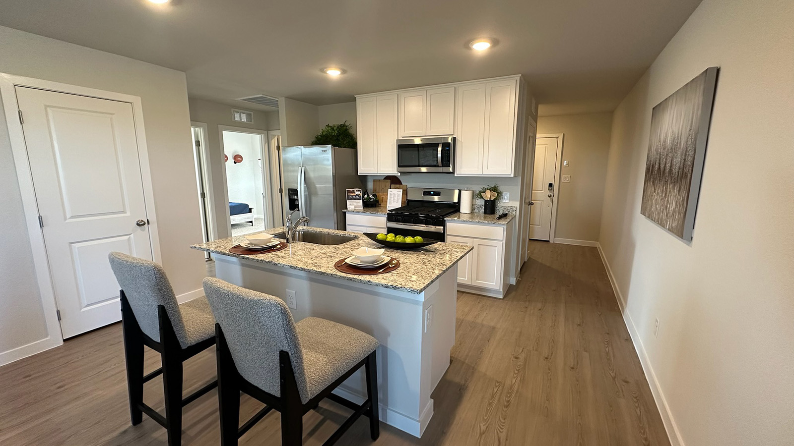 Kitchen with white cabinets and island