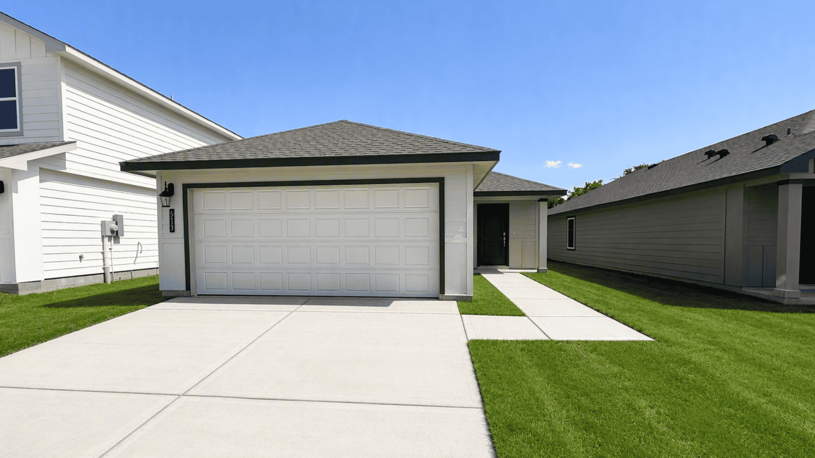 single family one story home with two car garage