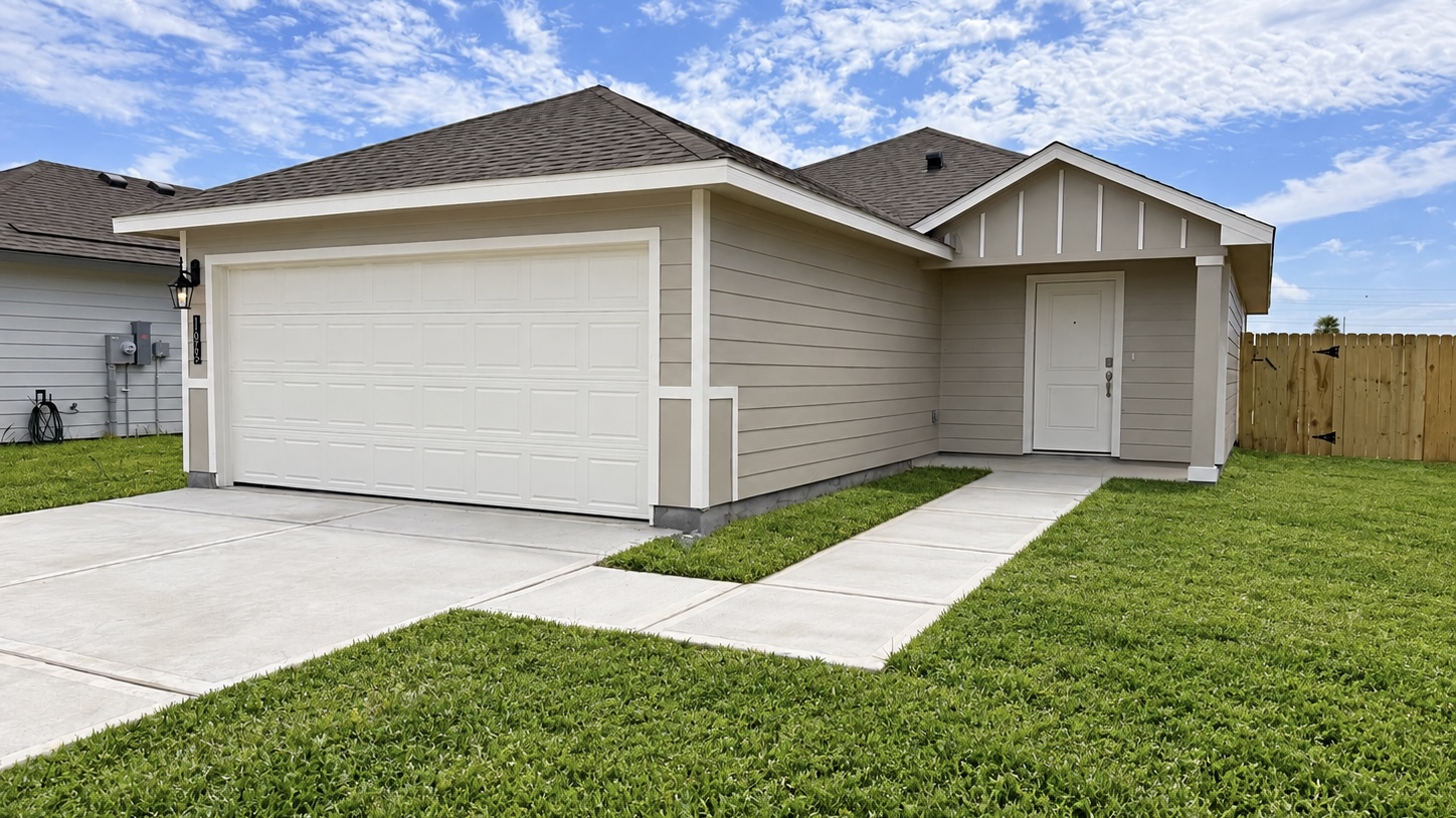 single family one story home with two car garage