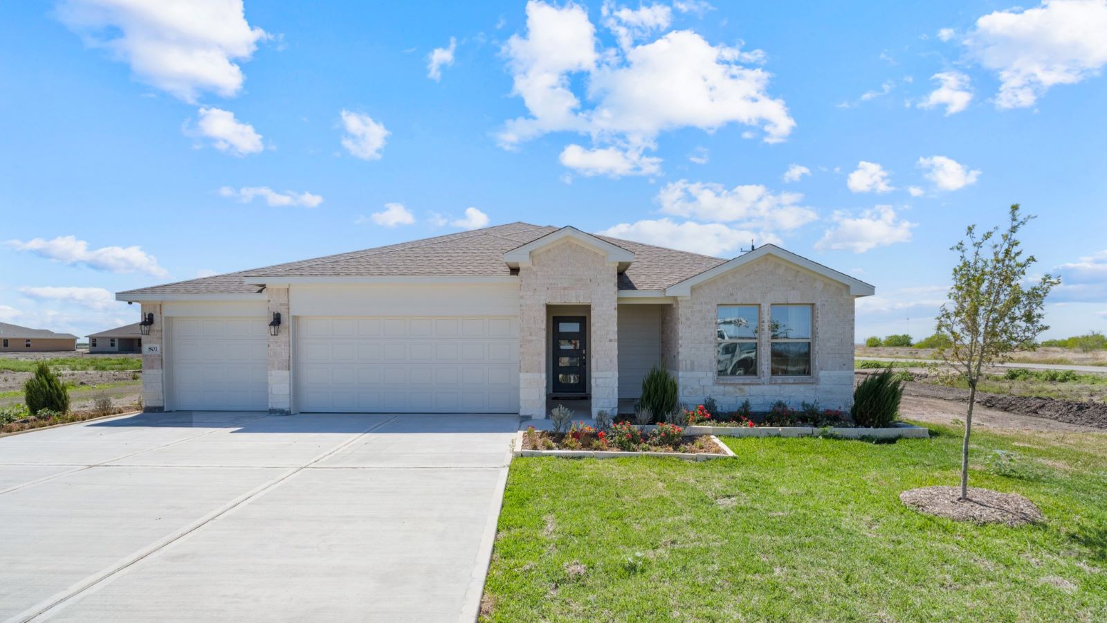 single family one story home with three car garage