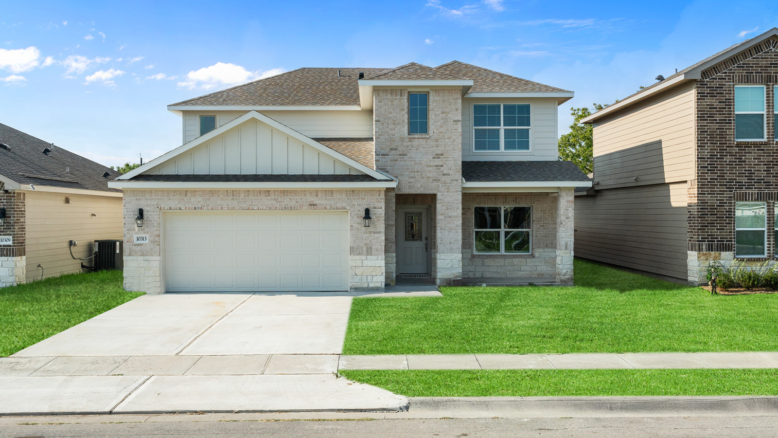 single family two story home with two car garage
