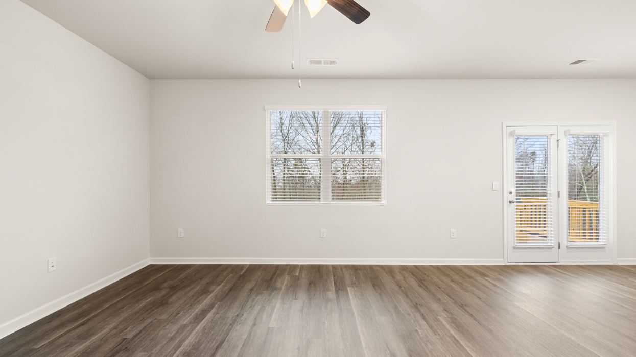 living room with natural light and ceiling fan