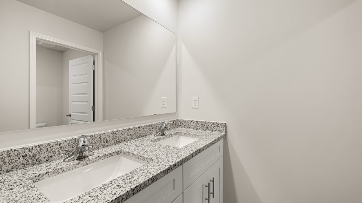 bathroom with dual sinks