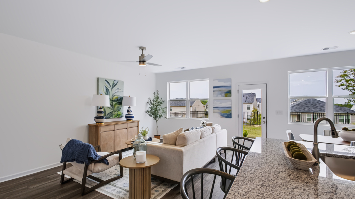 Open plan with modern kitchen overlooking the living and dining area