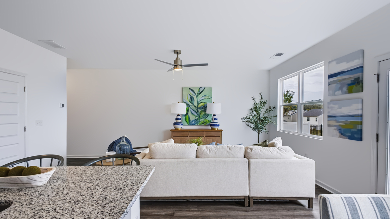 Open plan with modern kitchen overlooking the living and dining area
