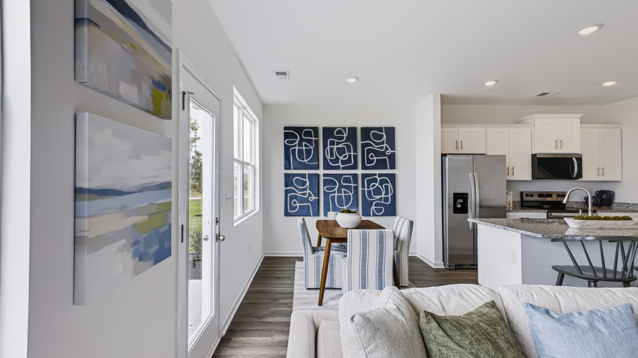 Open plan with modern kitchen overlooking the living and dining area
