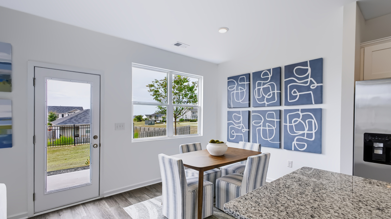 Dining area overlooking door to backyard