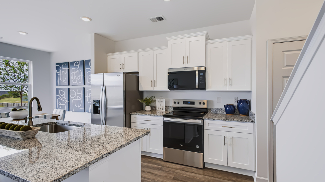 Modern kitchen with stainless appliances and large center island